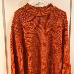 Chunky orange cable knit sweater
